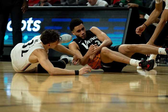 Cleveland State Vikings forward Tristan Enaruna (13) grabs a loose ball away from Cincinnati Bearcats forward Jarrett Hensley (32) in the first half of the men s NCAA basketball game between the Cincinnati Bearcats and the Cleveland State Vikings at Fifth Third Arena in Cincinnati on Thursday, Nov. 10, 2022. Cleveland State Vikings At Cincinnati Bearcats